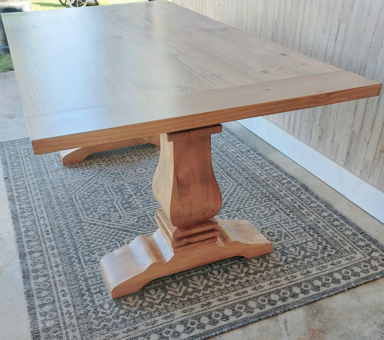 Handcrafted modern pedestal dining table in solid wood. Timeless farmhouse style with customizable sizes and finishes for any home.