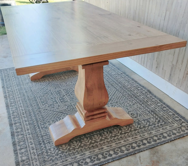 Handcrafted modern pedestal dining table in solid wood. Timeless farmhouse style with customizable sizes and finishes for any home.